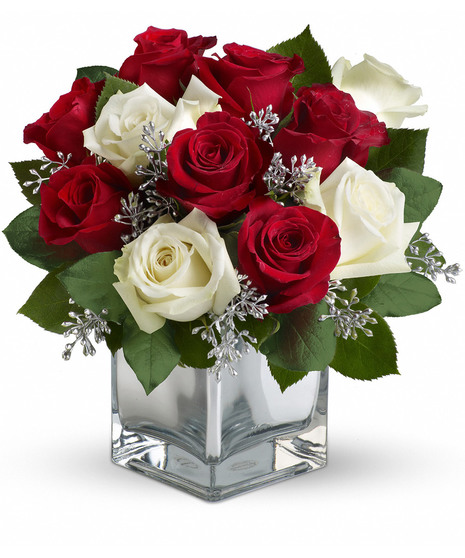 Bouquet of red and white roses in a dazzling mirrored cube is guaranteed to make spirits brighter.