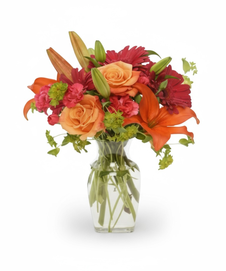   A traditional design of bright bouquet of roses, lilies, gerbera daisies and bupleurum